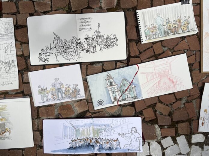 Ilustradores desenham músicos da Camerata Antiqua em ensaio na Capela Santa Maria